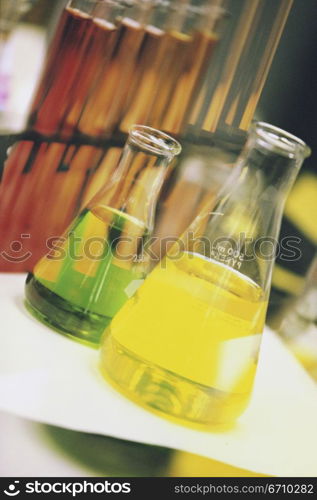 Close-up of beakers and a test tubes on a test tube rack