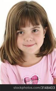 Close up of beautiful five year old girl. Shot in studio over white.