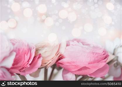 Close up of Beautiful pastel flowers with bokeh light. Festive greeting card. Floral border.