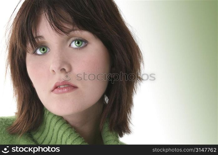 Close Up of Beautiful Teen Girl In Green Sweater. Dark hair and green eyes.