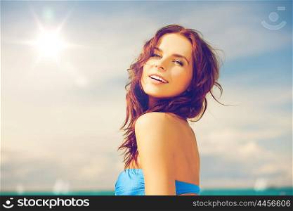 close up of beautiful woman in bikini smiling. woman in bikini smiling