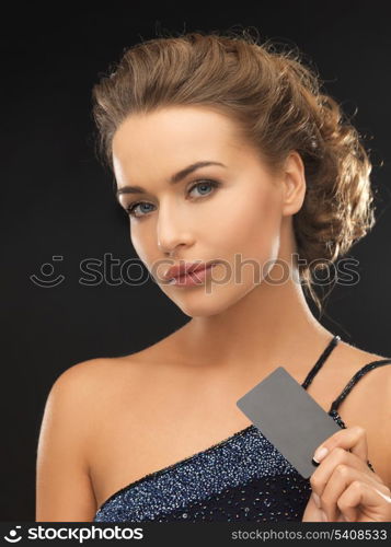 close up of beautiful woman in evening dress with small bag