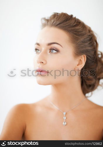 close up of beautiful woman wearing shiny diamond necklace