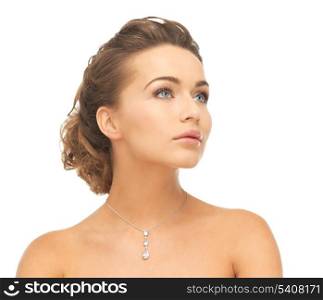 close-up of beautiful woman wearing shiny diamond necklace