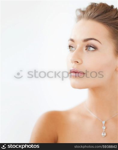 close up of beautiful woman wearing shiny diamond necklace. woman wearing shiny diamond necklace