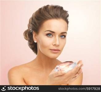 close-up of beautiful woman with earrings showing big diamond. woman showing big diamond