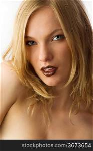 close-up of beautiful young fashion model with brown lips and blond hair