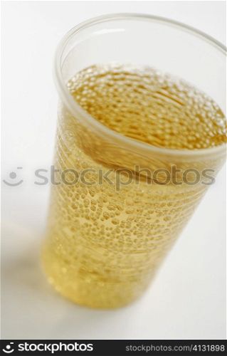 Close-up of beer in a disposable cup