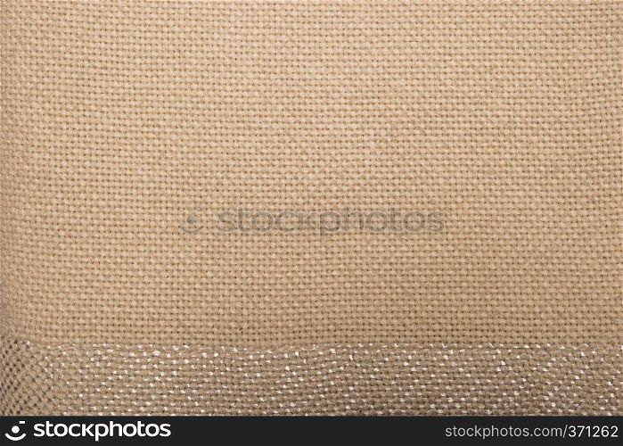 Close-up of beige fleece fabric, material texture background