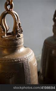 Close-up of bells hanging at Wat Phrathat Doi Suthep, Chiang Mai, Thailand