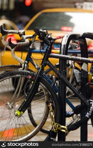 Close-up of bicycles parked at a bike rack, Chicago, Illinois, USA