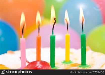 close-up of birthday cake with colorful candles