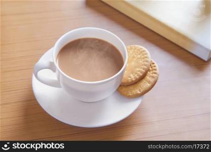 Close-up of biscuits and hot tea on table