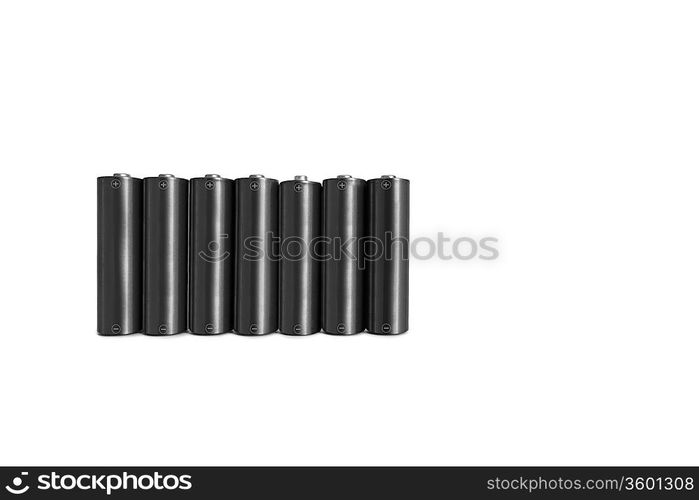 Close-up of black batteries over white background