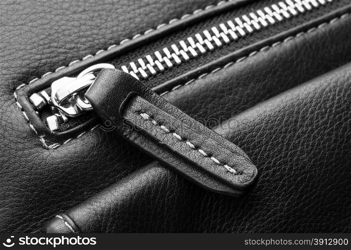 Close up of black leather bag zipper, black leather bag close up