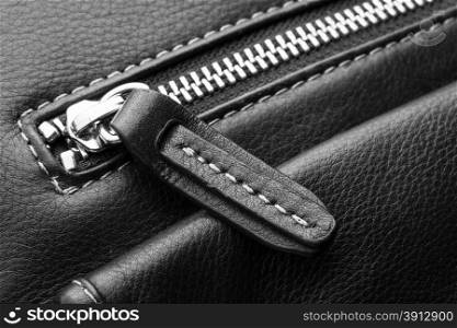Close up of black leather bag zipper, black leather bag close up