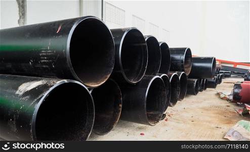 Close-up of black steel pipes for main work pipes, fire production system