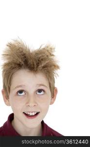 Close-up of blond boy looking up over white background