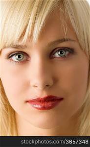 close up of blond girl with rich purple make up color