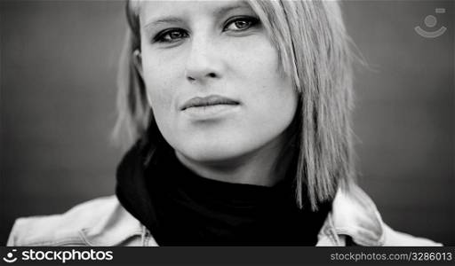 close-up of blond young woman ,urban portrait, natural light