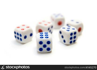 close up of blue and red dice on white background