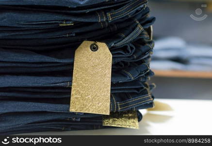 Close up of blue jeans on others with copy space  Various jeans on others with space for text  Clothes sale concept. Close up of blue jeans on others with copy space, Various jeans on others with space for text, Clothes sale concept