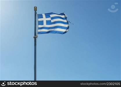 Close up of blue nad white Greek flag waving on wind. National landmark concept.. Greek flag waving o wind.