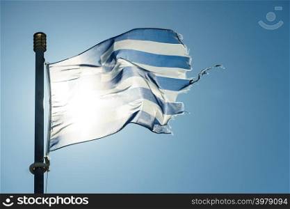 Close up of blue nad white Greek flag waving on wind. National landmark concept.. Greek flag waving o wind.