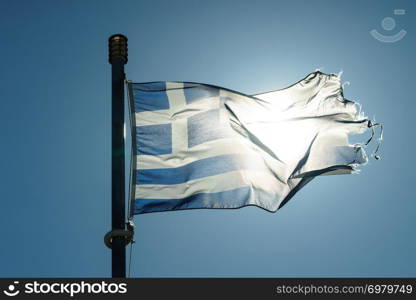 Close up of blue nad white Greek flag waving on wind. National landmark concept.. Greek flag waving o wind.