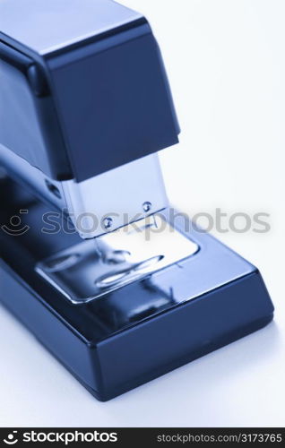 Close up of blue stapler on white background.