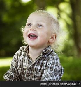 Close up of boy laughing outdoors