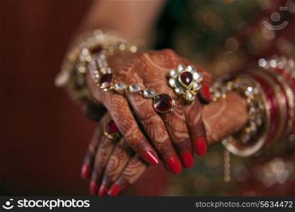 Close-up of bridal hands with henna tattoo design