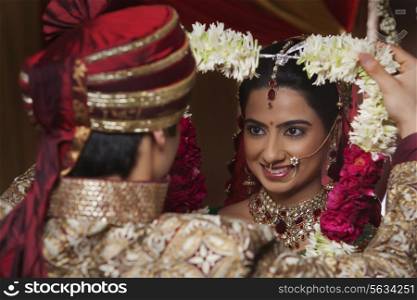 Close-up of bride and groom during wedding ceremony