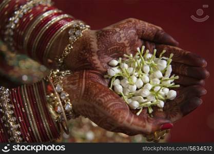 Close-up of bride holding jasmine flower