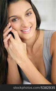 Close-up of brunette making telephone call