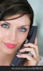 Close-up of brunette on the phone
