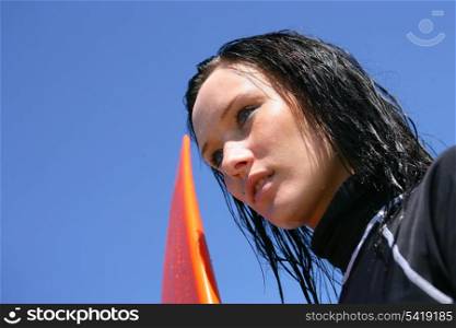 Close-up of brunette with surf board