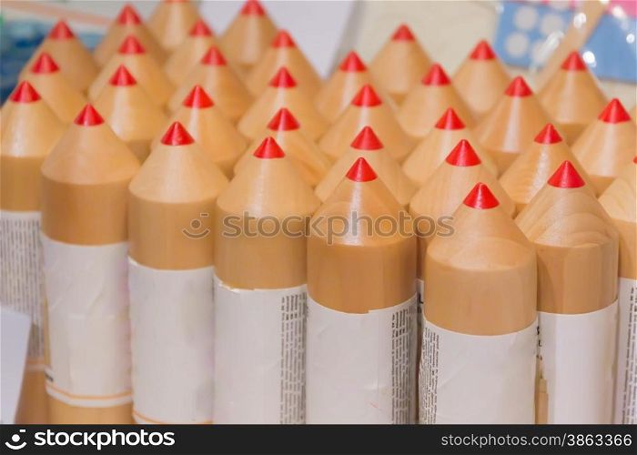 close-up of bundle of big pencils with red end