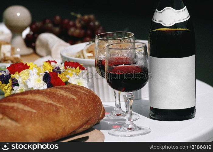 Close up of Burgundy wine and French bread arranged on a table, France