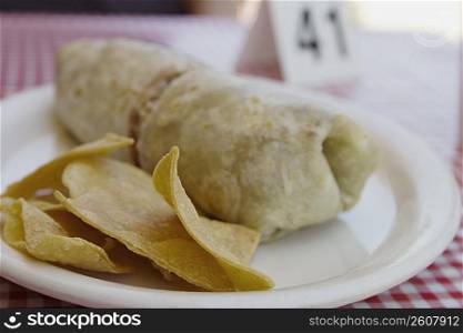 Close-up of burrito and chips