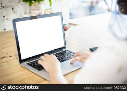 Close-up of business female working with laptop and smartphone in coffee shop like the background