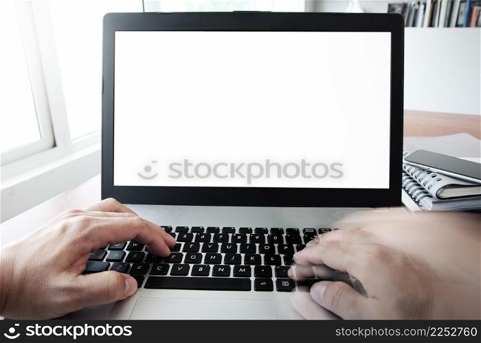 Close up of business man hand working on blank screen laptop computer on wooden desk as concept