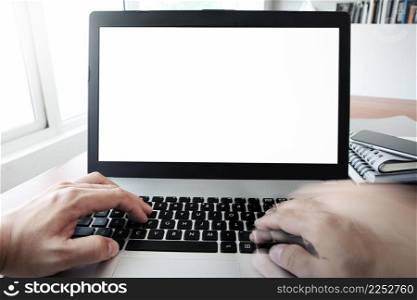 Close up of business man hand working on blank screen laptop computer on wooden desk as concept