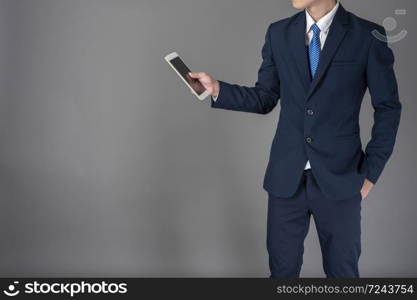 Close up of business man is using tablet