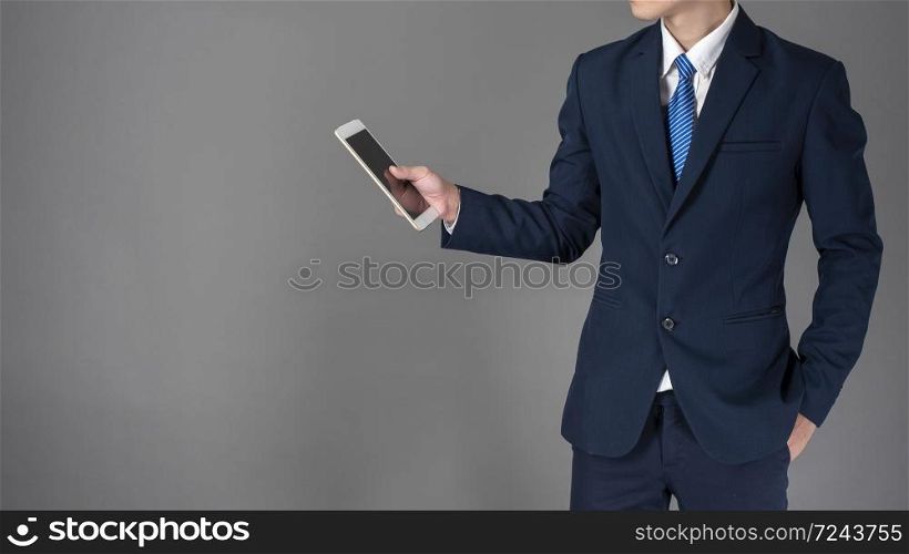 Close up of business man is using tablet