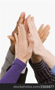 Close-up of business people&acute;s hand giving high-five
