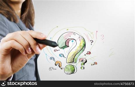 Close up of business woman drawing question mark. Draw your question