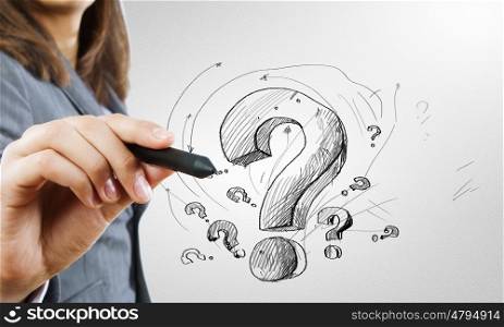 Close up of business woman drawing question mark. Draw your question
