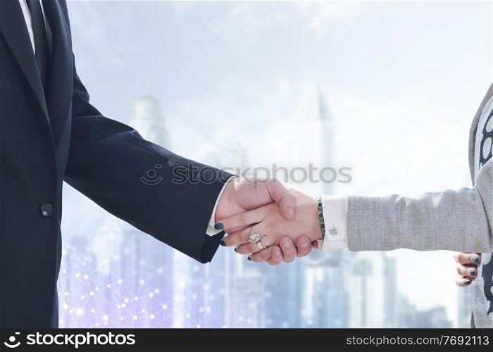 close up of businessman and businesswoman handshake