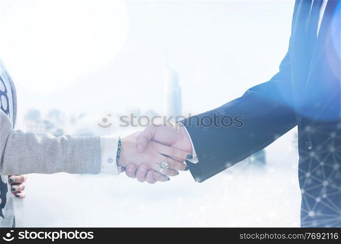 close up of businessman and businesswoman handshake